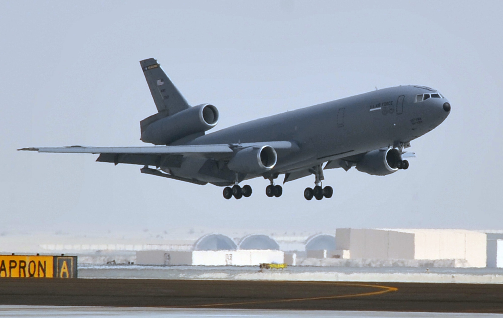A flight crew from the 908th Expeditionary Air Refueling Squadron brings a KC-10 Extender in for a landing June 7, 2010, after completing a combat mission in the U.S. Central Command area of responsibility. The 908th EARS, as part of the 380th Air Expeditionary Wing, supports operations Iraqi Freedom, Enduring Freedom, and the Combined Joint Task Force-Horn of Africa. (U.S. Air Force Photo/Master Sgt. Scott T. Sturkol/Released)