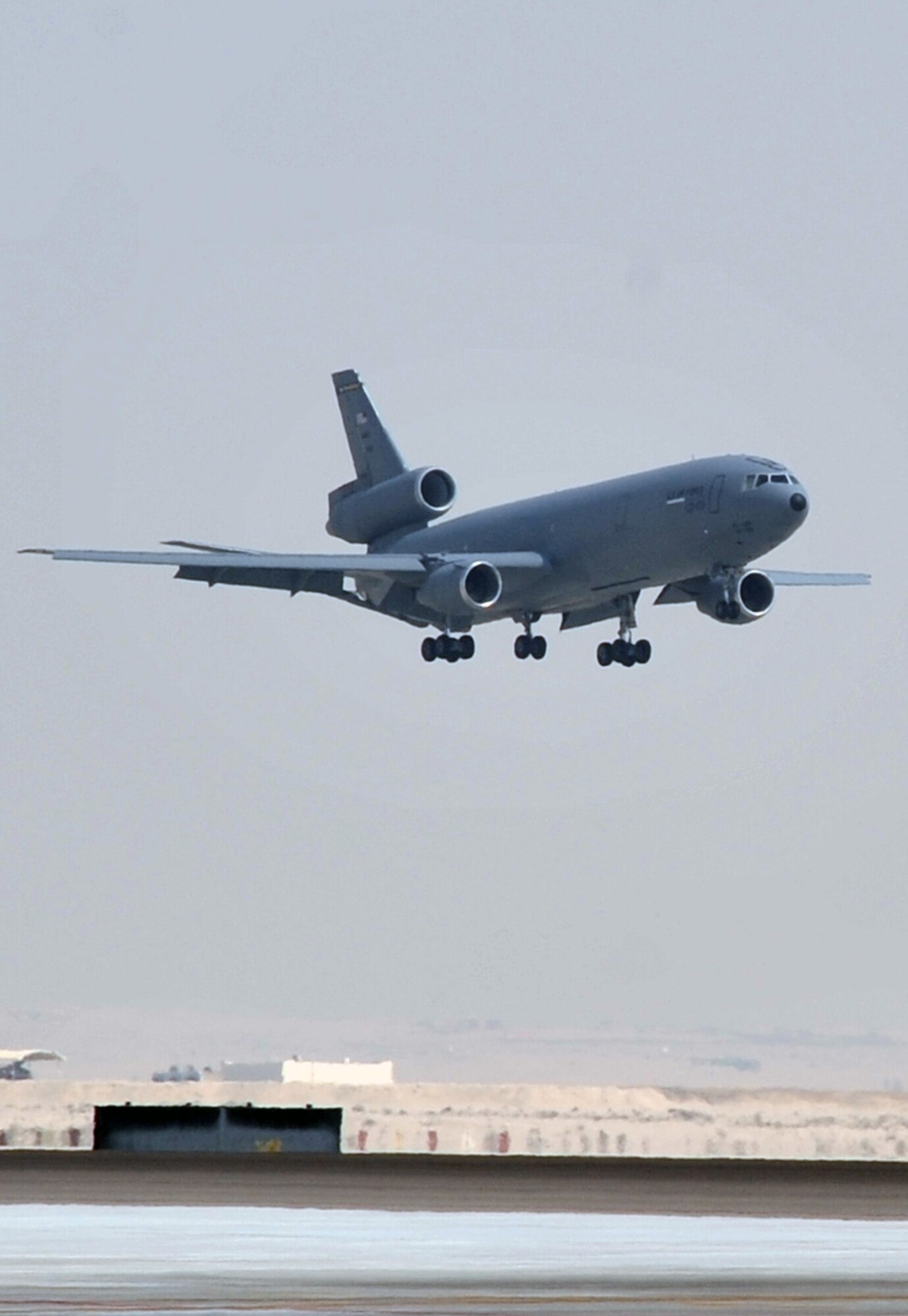 A flight crew from the 908th Expeditionary Air Refueling Squadron brings a KC-10 Extender in for a landing June 7, 2010, after completing a combat mission in the U.S. Central Command area of responsibility. The 908th EARS, as part of the 380th Air Expeditionary Wing, supports operations Iraqi Freedom, Enduring Freedom, and the Combined Joint Task Force-Horn of Africa. (U.S. Air Force Photo/Master Sgt. Scott T. Sturkol/Released)