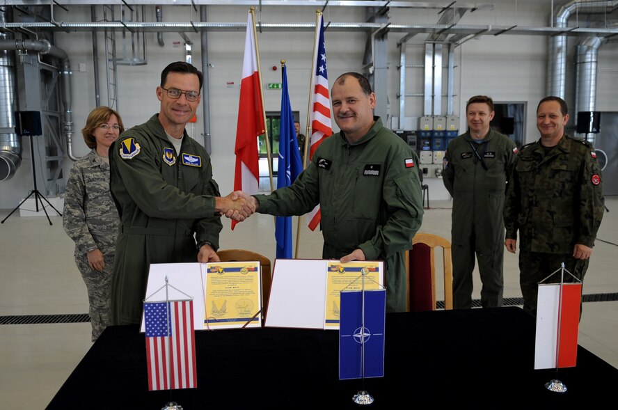 U.S. Air Force Brig. Gen. Mark Dillon, 86th Airlift Wing commander, and Poland Air Force Brig. Gen. Tadeusz Mikutel, 3rd Airlift Wing commander, pose for a photo during a visit on Powidz Air Base, Poland, June 21, 2010. The purpose of General Dillon's visit to Poland was to sign the letter designating the 86th AW and the 3rd Airlift Wing as 'sister wings' and to build partnerships. (U.S. Air Force photo by Airman 1st Class Grovert Fuentes-Contreras)(Released)