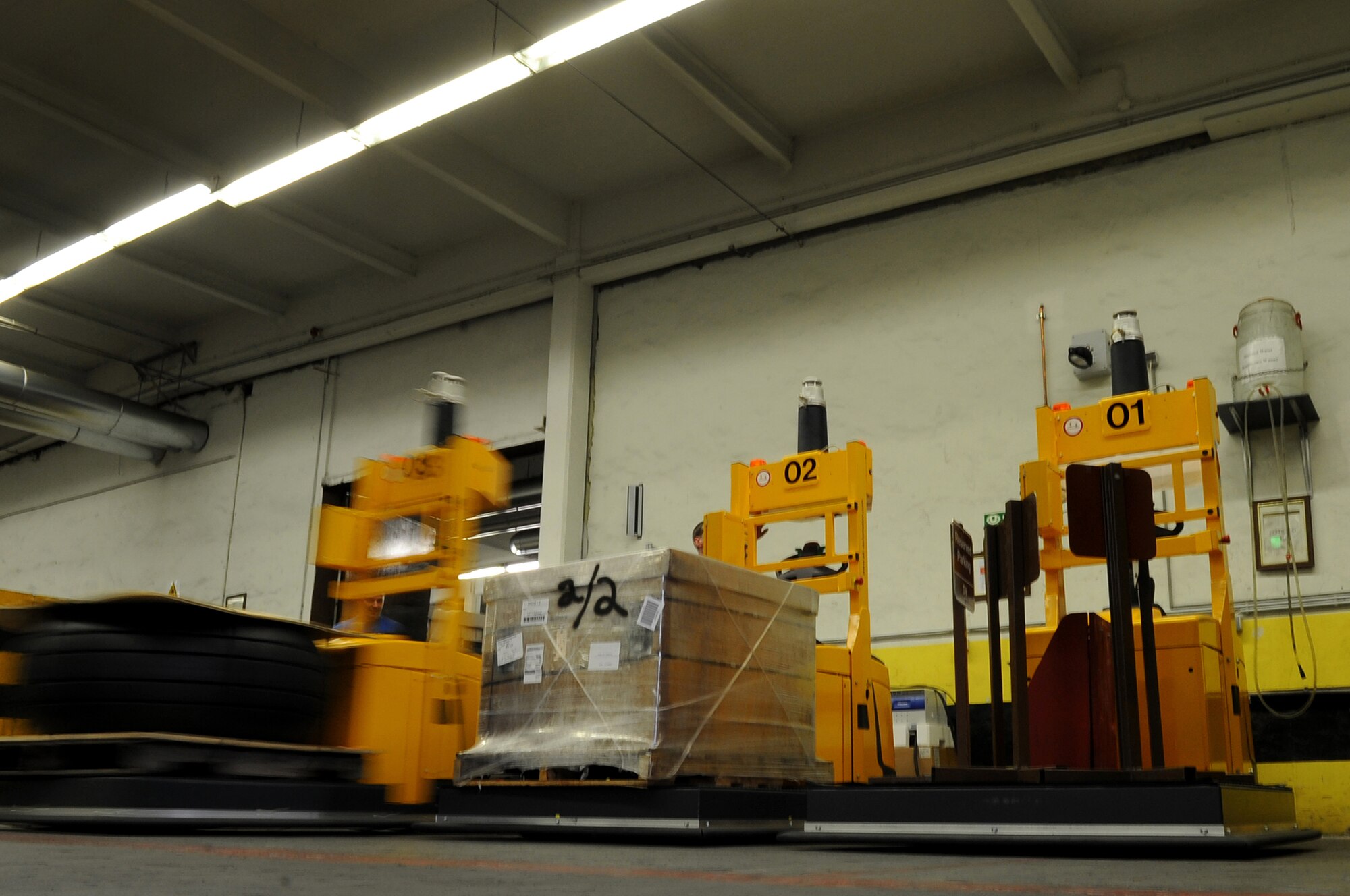 An Automated Guided Vehicle parks in its charging location according to an operator's command during a showcase of the new equipment, Ramstein Air Base, Germany, June 17, 2010. The 86th Logistics Readiness Squadron material management flight are the first to ever use these AGVs in all of United States Air Forces in Europe. (U.S. Air Force photo by Airman 1st Class Grovert Fuentes-Contreras)(Released)