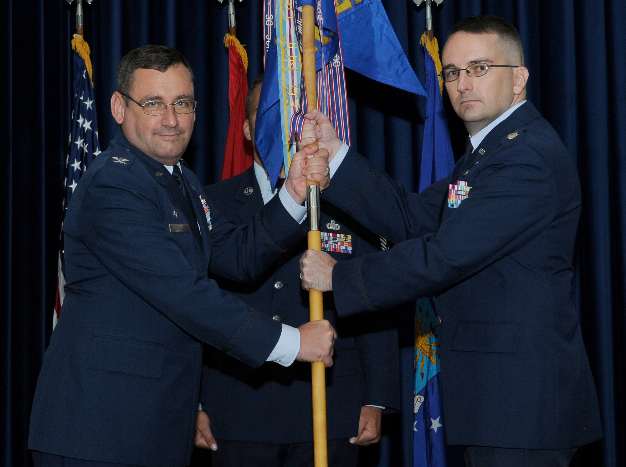 Lt. Col. Jason Branch (right) accepts command of the 39th Logistics Readiness Squadron from Col. Andrew Pears, 39th Mission Support Group commander, during the change of command ceremony Thursday, June 17, 2010 at Incirlik Air Base Incirlik, Turkey. Prior to taking command of the 39th LRS, Colonel Branch was the Chief, Supply Chain Distribution Policy Branch, Directorate of Logistics, Headquarters Air Force, Pentagon, Washington, D.C. The change of command ceremony is a symbolic gesture to be viewed by the unit so all may see their new leader take command. (U.S. Air Force photo/Senior Airman Alexandre Montes)