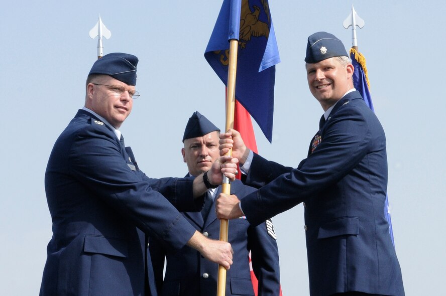 Lt. Col. Bryan Wolford (right), accepts command of the 39th  Operations Squadron from Col. Eric Beene, 39th Air Base Wing commander, during the change of command ceremony Tuesday, June 22, 2010 at Incirlik Air Base Incirlik, Turkey. Prior to taking command of the 39th OS, Colonel Wolford was the assistant director of operations for the 555th Fighter Squadron, Aviano Air Base, Italy. The change of command ceremony is a symbolic gesture to be viewed by the unit so all may see their new leader take command. (U.S. Air Force photo/Senior Airman Alexandre Montes)