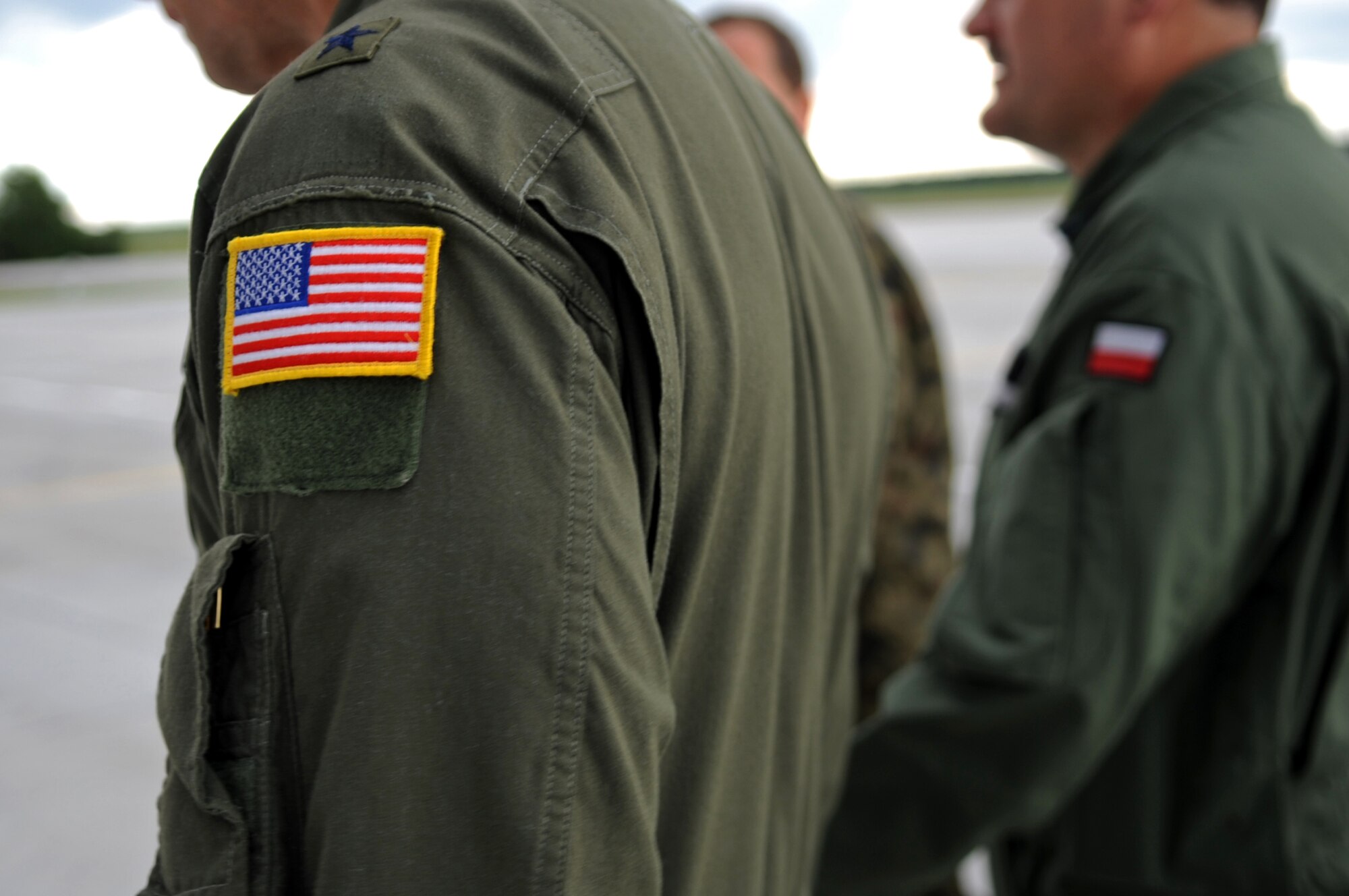 U.S. Air Force Brig. Gen. Mark Dillon, 86th Airlift Wing commander, and Polish Air Force Brig. Gen. Tadeusz Mikutel, 3rd Airlift Wing commander, walk to a ceremony on Powidz Air Base, Poland, June 21, 2010. The purpose of General Dillon's visit to Poland was to sign the letter designating the 86th AW and the 3rd Airlift Wing as 'sister wings' and to build partnerships. (U.S. Air Force photo by Airman 1st Class Grovert Fuentes-Contreras)(Released)