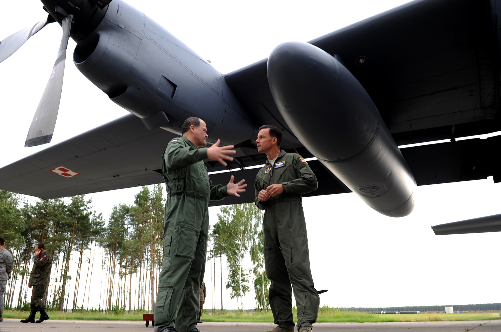 U.S. Air Force Brig. Gen. Mark Dillon, 86th Airlift Wing commander, and Polish Air Force Brig. Gen. Tadeusz Mikutel, 3rd Airlift Wing commander, discuss Polish aircraft on Powidz Air Base, Poland, June 21, 2010. The purpose of General Dillon's visit to Poland was to sign the letter designating the 86th AW and the 3rd Airlift Wing as 'sister wings' and to build partnerships. (U.S. Air Force photo by Airman 1st Class Grovert Fuentes-Contreras)(Released)