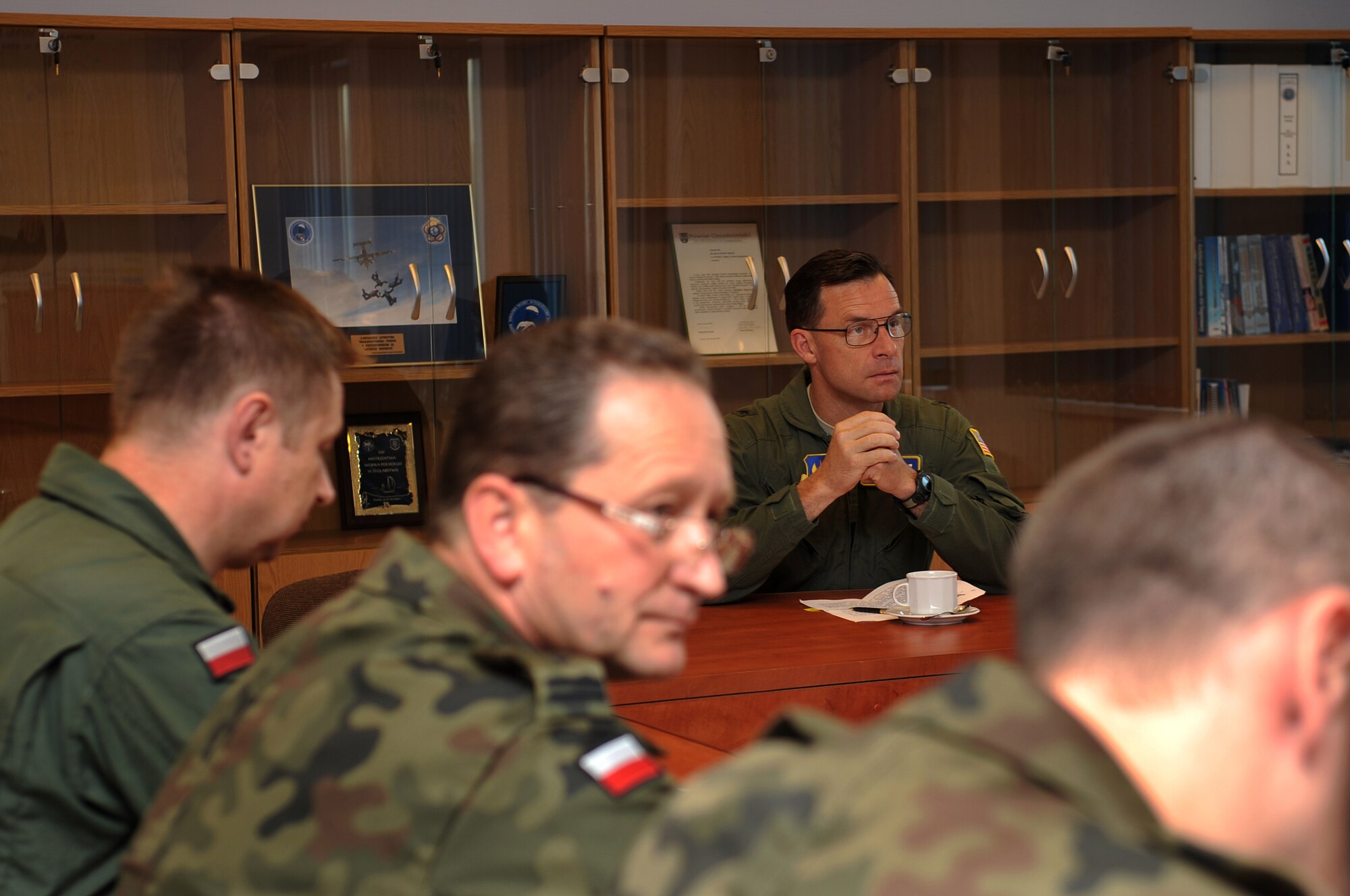 U.S. Air Force Brig. Gen. Mark Dillon, 86th Airlift Wing commander, listens to a briefing upon arriving on Powidz Air Base, Poland, June 21, 2010. The purpose of General Dillon's visit to Poland was to sign the letter designating the 86th AW and the 3rd Airlift Wing as 'sister wings' and to build partnerships. (U.S. Air Force photo by Airman 1st Class Grovert Fuentes-Contreras)(Released)