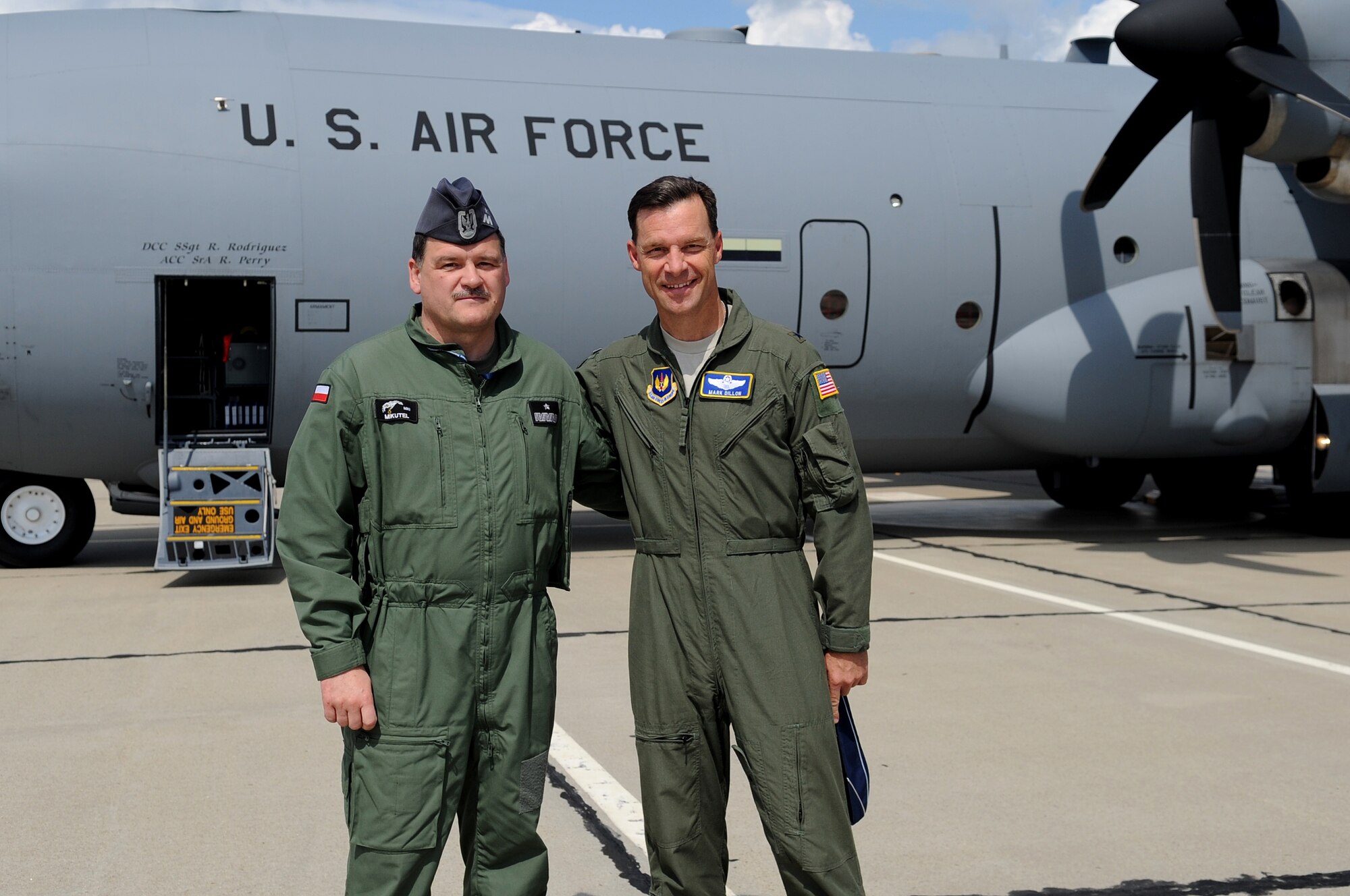 U.S. Air Force Brig. Gen. Mark Dillon, 86th Airlift Wing commander, and Poland Air Force Brig. Gen. Tadeusz Mikutel, 3rd Airlift Wing commander, pose for a photo during a visit on Powidz Air Base, Poland, June 21, 2010. The purpose of General Dillon's visit to Poland was to sign the letter designating the 86th AW and the 3rd Airlift Wing as 'sister wings' and to build partnerships. (U.S. Air Force photo by Airman 1st Class Grovert Fuentes-Contreras)(Released)