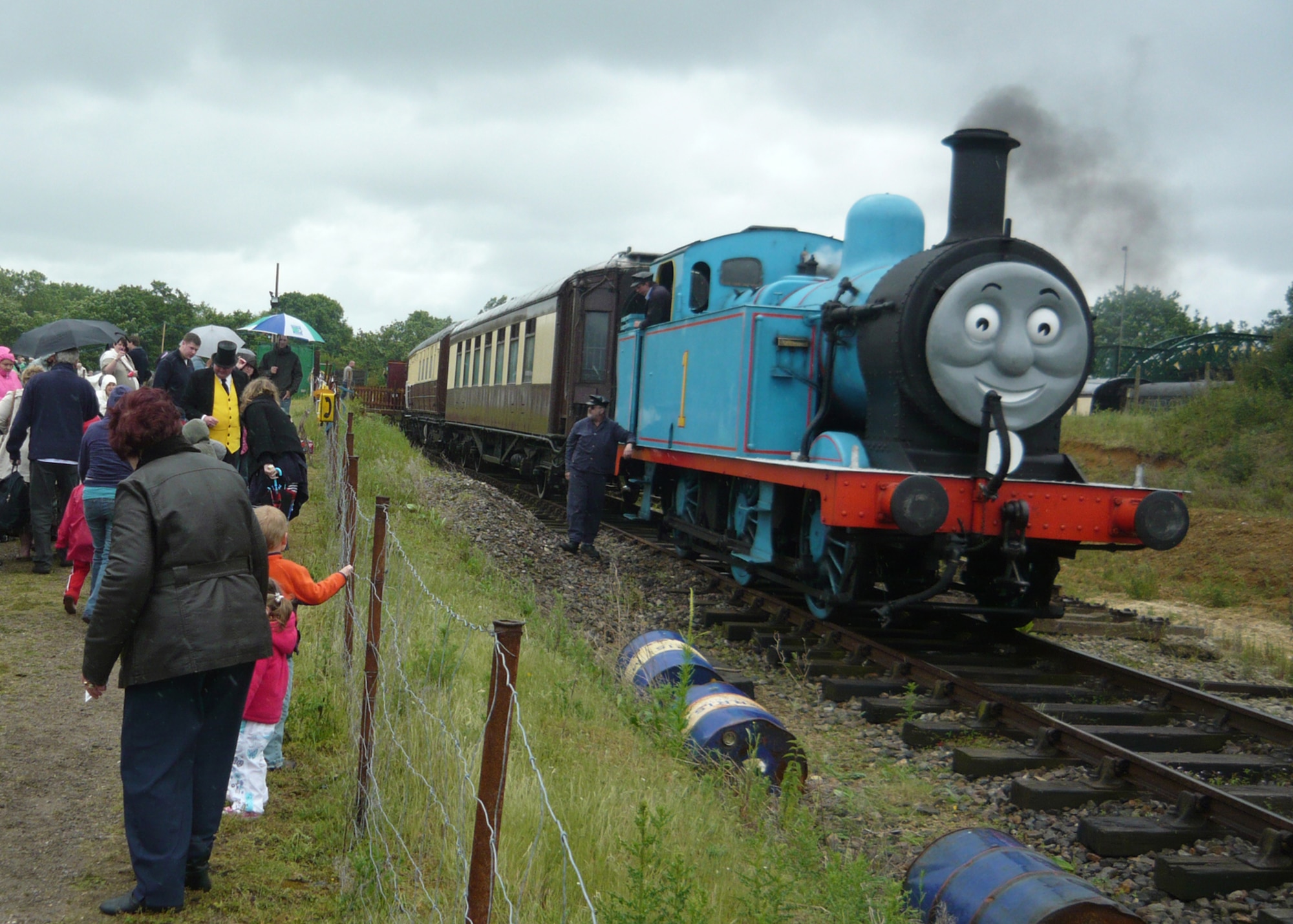 Children and parents admire Thomas the Tank Engine June 19 at the Colne Valley Railway in Essex. Outdoor Recreation organizes DePLAYment trips to places like Colne Valley for families with deployed members. (U.S. Air Force photo/Senior Airman David Dobrydney)