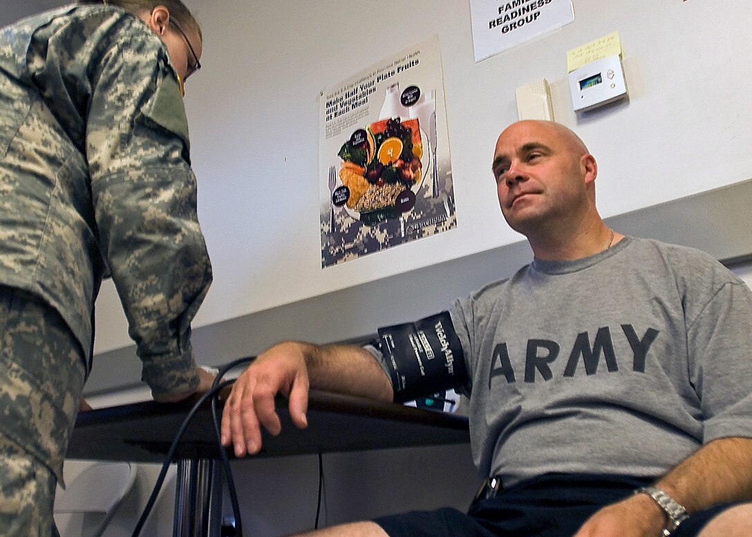 First Sgt. Timothy McDaniel of Greenwood, Ind., top non-commissioned officer of Headquarters and Headquarters Company, 113th Engineer Battalion, headquartered in Gary, Ind., gets his blood pressure read during a periodical health assessment June 17, 2010, during annual training at the Camp Atterbury Joint Maneuver Training Center's Troop Medical Clinic in central Indiana. 
