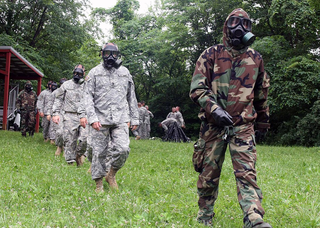 Command Sgt. Maj. Charles Isaac, front, 81st Troop Command, Indiana Army National Guard, marches toward the gas chamber at Camp Atterbury, Ind., on June 15, 2010. Isaac volunteered to participate in the event conducted by the 438th Chemical Company. 