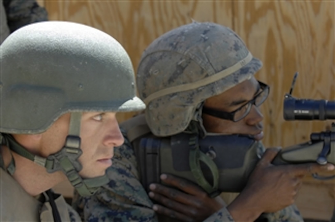 U.S. Marine Corps Sgt. Colin Smith (left) and Lance Cpl. Jazzmon Howard, both with the Surveillance and Target Acquisition Platoon, Headquarters and Support Company, 1st Battalion, 24th Marine Regiment out of Selfridge Air National Guard Base, Mich., acquire range estimations for an M-40A5 sniper rifle at a training site near Hawthorne, Nev., during Javelin Thrust 2010 on June 20, 2010.  More than 4,500 Marines participated in exercise Javelin Thrust 2010.  The Marine demonstrated combat and logistic capabilities during the Marine Corps Reserve exercise.  