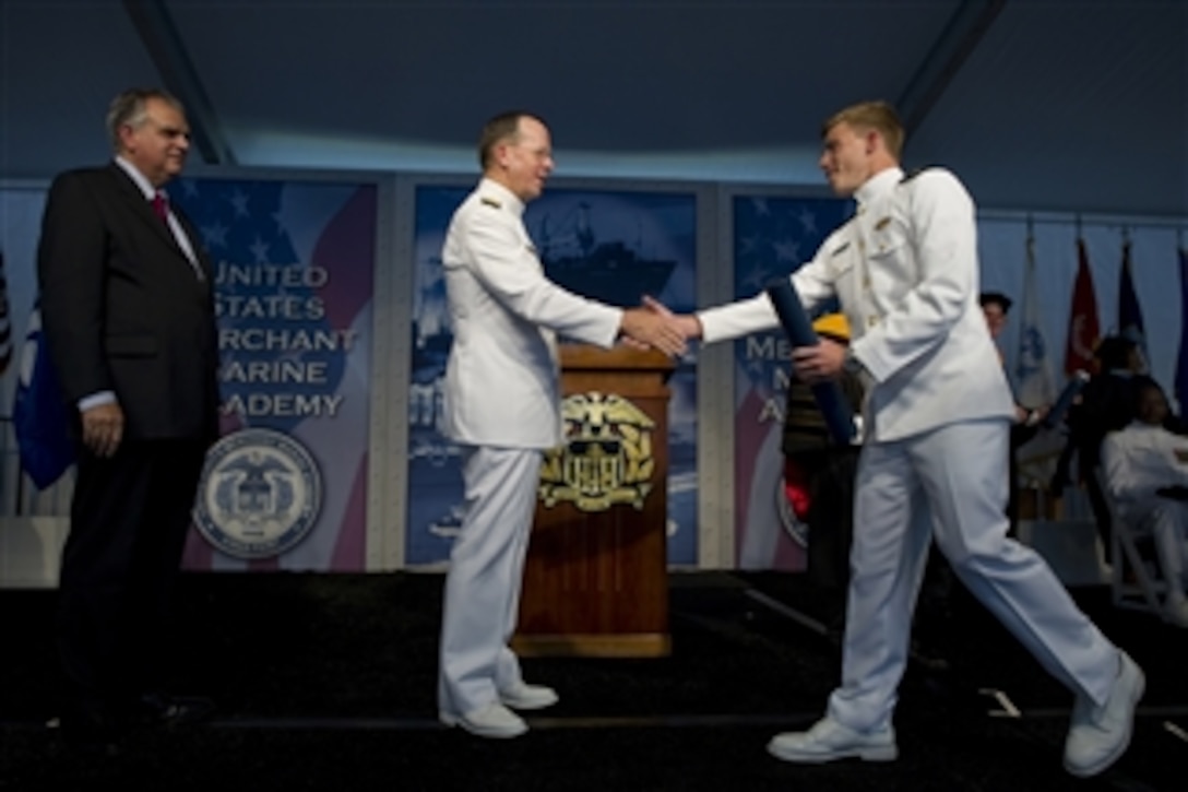 Chairman of the Joint Chiefs of Staff Adm. Mike Mullen and Secretary of Transportation Ray LaHood (left) congratulate midshipman Gary Taylor at the Seventy-Fourth commencement exercises at the U.S. Merchant Marine Academy in Kings Point, N.Y., on June 21, 2010.  As one of the five U.S. service academies, the USMMA is responsible for training midshipmen for service in the Merchant Marines, the maritime industries or the other five branches of the military, both at sea and ashore.  