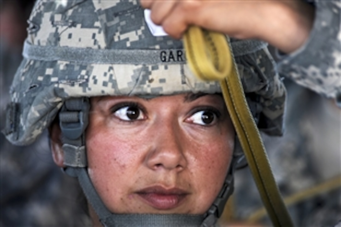 U.S. Army Staff Sgt. Amanda Garcia practices her jumping technique during a forcible entry exercise on Pope Air Force Base, N.C., June 21, 2010. Garcia is assigned to the 82nd Airborne Division. The exercise is a primary tool for the 82nd Airborne Division's brigades to train for real-world contingency operations.