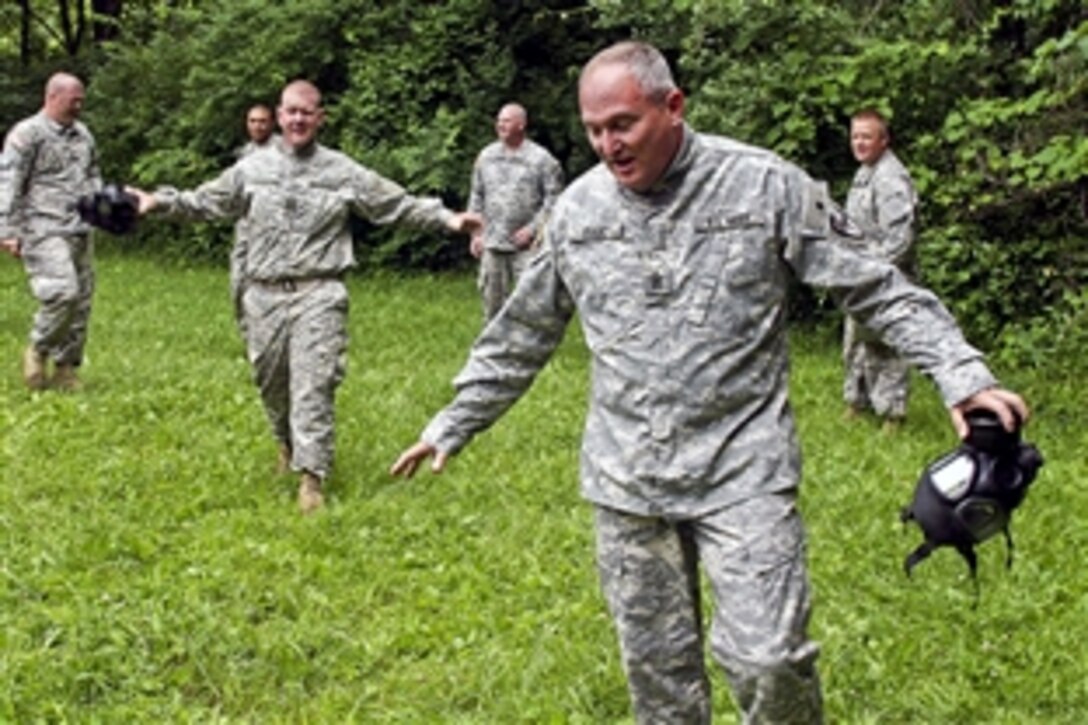 U.S. Army Command Sgt. Maj. Charles Isaac and other soldiers air out after exiting the gas chamber on Camp Atterbury, Ind., June 15, 2010. Isaac is assigned to the 81st Troop Command, Indiana Army National Guard. 