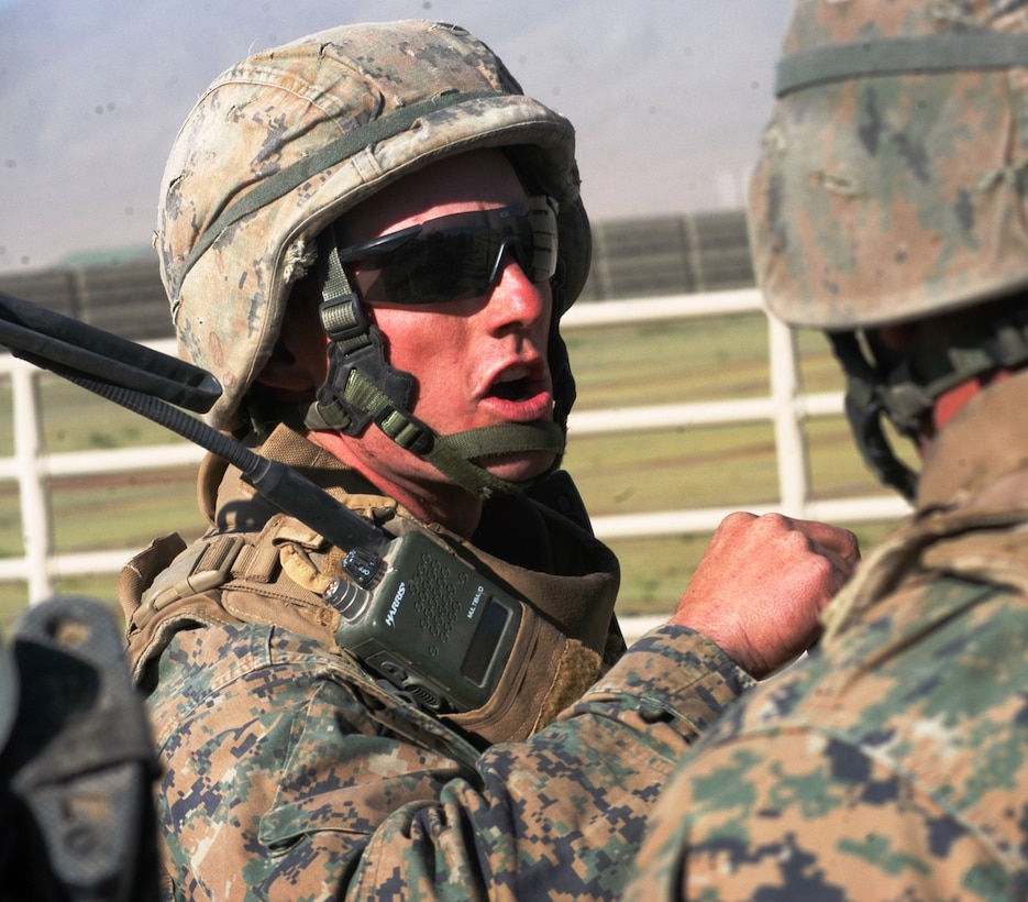 Second Lt. Ernest Zacher, platoon commander for 1st Platoon, Company B, 1st Battalion, 24th Marine Regiment, instructs his Marines before assaulting a building at Fallon Air Base, Nev., June 22, 2010.  His platoon was the assault element during a daytime raid as part of Javelin Thrust 2010’s final exercise.