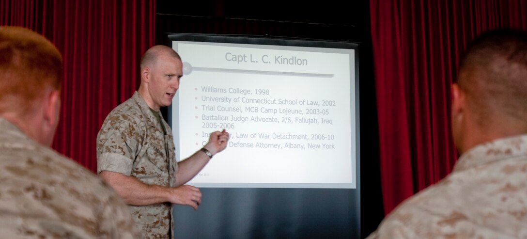 Capt. Lee C. Kindlon, a criminal defense attorney with the Marine Corps Mobilization Command, gives a Law of War and Unit-level Rules of Engagement brief to U.S. Marine Corps Forces, Pacific, personnel June 23 at the Sunset Lanai, Camp H. M. Smith, Hawaii. The event fulfilled annual training requirements and gave the Marines an opportunity to clarify any misconceptions about current ROEs in Afghanistan.