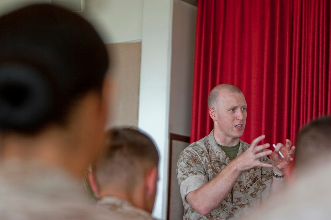 Capt. Lee C. Kindlon, a criminal defense attorney with the Marine Corps Mobilization Command, gives a Law of War and Unit-level Rules of Engagement brief to U.S. Marine Corps Forces, Pacific, personnel June 23 at the Sunset Lanai, Camp H. M. Smith, Hawaii. The event fulfilled annual training requirements and gave the Marines an opportunity to clarify any misconceptions about current ROEs in Afghanistan.