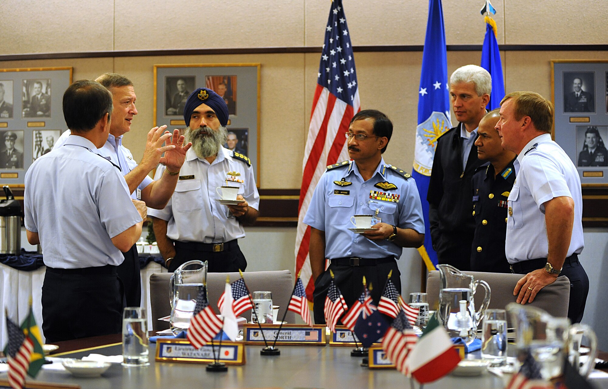 Gen. Gary North, Pacific Air Forces commander, talks with leaders from around the globe just before a round-table discussion at Joint Base Elmendorf-Richardson, Alaska, during the Executive Observer Program June18. During the program, General North, as well as several executive observers, participated in presentations and discussions on how the U.S. Air Force integrates and synchronizes service capabilities, resources and effects to meet national challenges. (Air Force photo/SrA Cynthia Spalding)