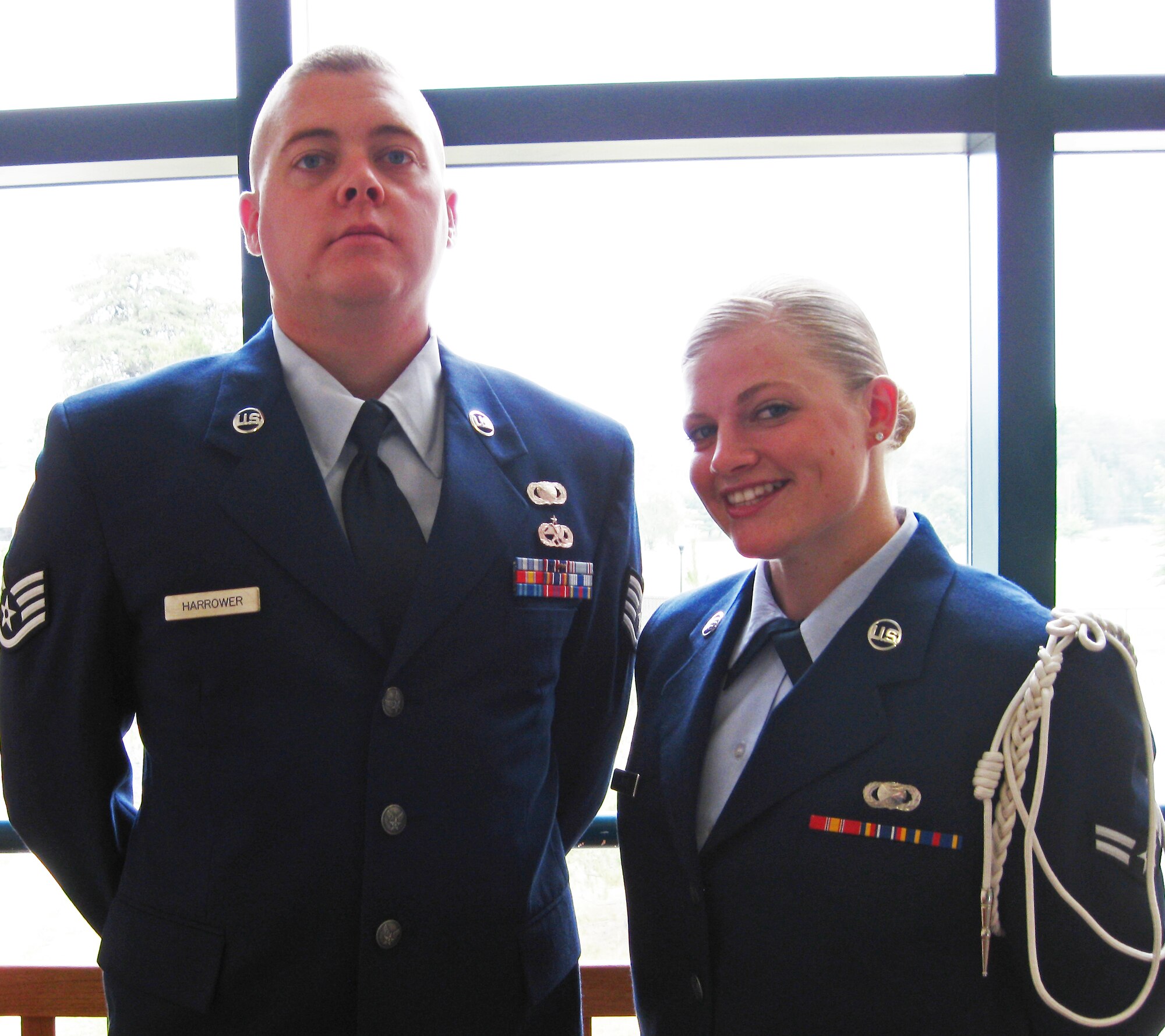 TRAVIS AIR FORCE BASE, Calif. --  A1C Amelia Leonard joins the Reserve's 349th Air Mobility Wing PA office and Staff Sgt. Patrick Harrower is on the 60th AMW staff beginning in July. Both graduated from the Defense Information School's latest Basic Public Affairs Specialist Course, Class 060-10 June 14. Airman Leonard wears the white rope of the chaplain assistant leader for her class. The class was one of the largest recently, with 48 graduates. Airman Leonard is a native of Walnut Grove, Calif., so the 349th AMW will be home for her. (U.S. Air Force photo/Senior Master Sgt. Ellen L. Hatfield)                               
