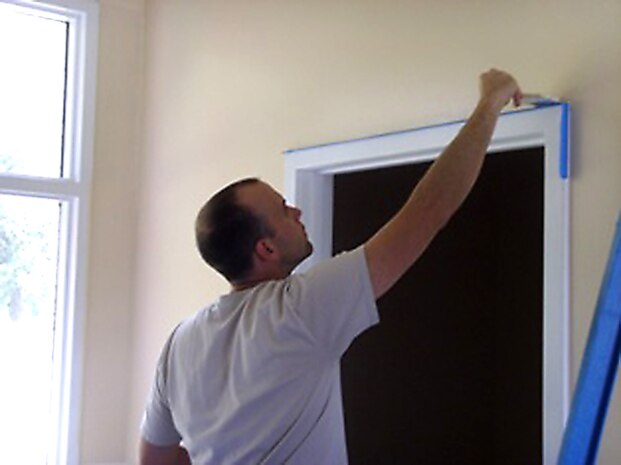 Senior Airman Ryan Hare applies paint around the trim of a doorway at Windwood Farm in Awendaw, S.C., June 19, 2010. The event was led by Airmen Against Drunk Driving. After a morning of work, members of Windwood Farm provided lunch for the volunteers and children living there to enjoy together. Airman Hare is with the 437th Aircraft Maintenance Squadron. (Courtesy photo)