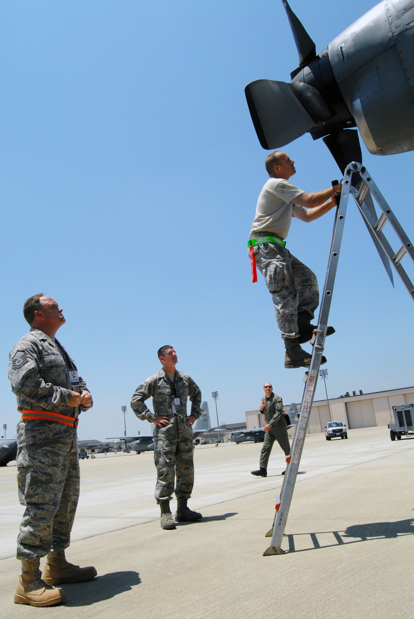 Tech Sgt. Steve Miller (far right), 43rd Aircraft Maintenance Squadron, checks the intake and exhaust on a C-130 propeller on the Pope flightline as Master Sgt. Bradley Candler (far left), Little Rock Air Force Base, Ark., and Tech Sgt. Chris Mitchell, Cheyenne Air National Guard, observe during the Logistics Capability Assessment Program inspection, June 17. Sergeants Candler and Mitchell are members of the LCAP inspection team and are at Pope to conduct the bi-annual LCAP inspection. (U.S. Air Force Photo/ 1st Lt. Cammie Quinn)