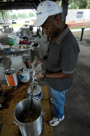 Alphonso Jones fries a batch of fish at the third annual Juneteenth Fish Fry at the base picnic grounds on Joint Base Charleston, S.C., June 17, 2010. The Juneteenth Fish Fry is a celebration of the delayed emancipation of Texan African Americans in 1865. The event was hosted by the African American Heritage Council to commemorate this historical event. Mr. Jones is a project manager with the 628th Communications Squadron. (U.S. Air Force Photo/Airman 1st Class Lauren Main)