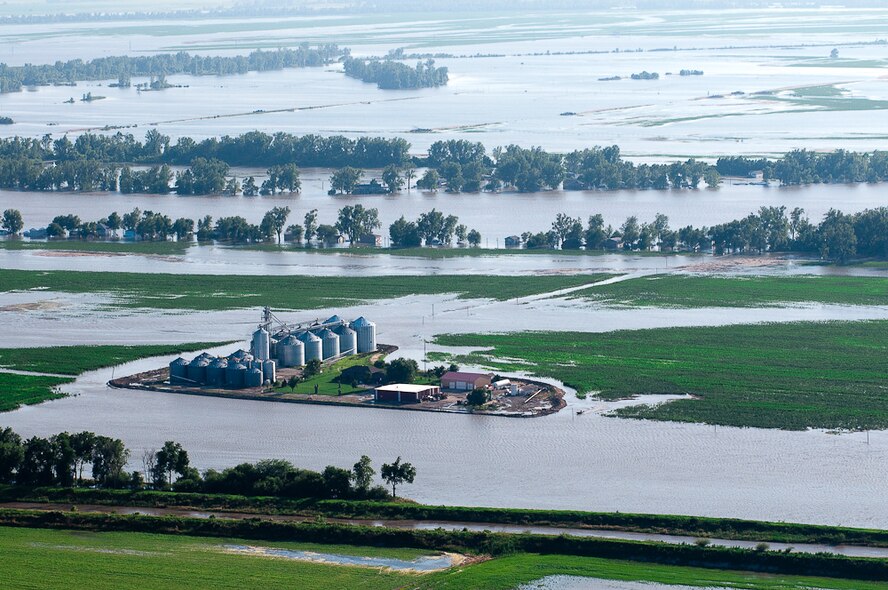 A farm is engulfed by flood water as it spreads through Northern Missouri in June of 2010, after weeks of heavy rains and massive storms. Mo. Governor Jay Nixon declared a state of emergency on June 21, 2010 and has been traveling north to survey the effected towns and provide assistance where needed. (U.S. Air Force photo by Master Sgt. Shannon Bond/Released)