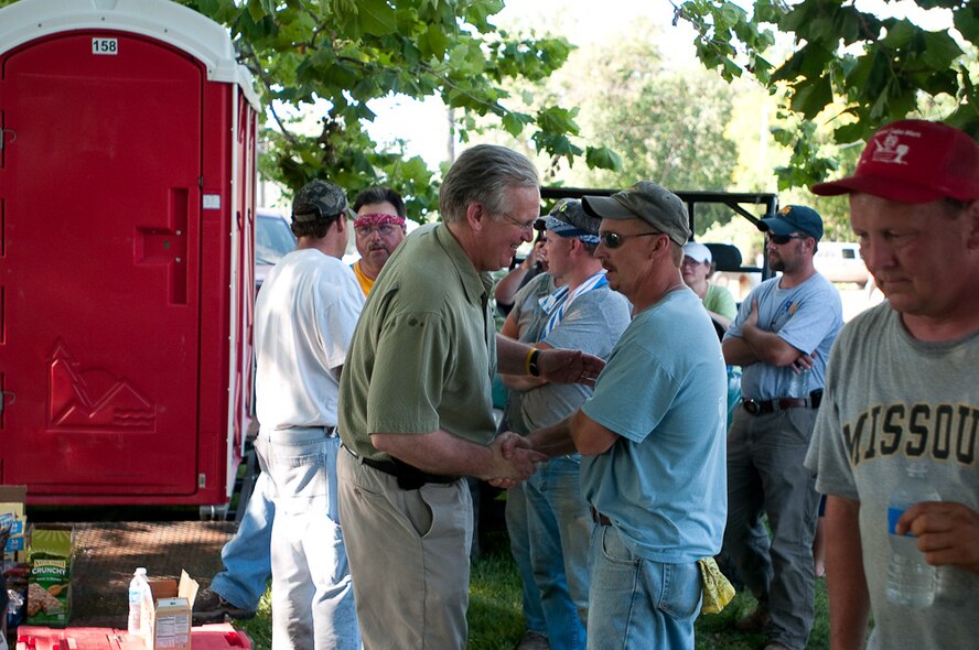 Governor Jay Nixon visits with American Red Cross members in the town of  Fortescue, in Northern Missouri, on June 22, 2010,  as devastating flood waters spread throughout the rural landscape and threaten this small town. Gov. Nixon is accompanied by Brigadier General Stephen Danner, Mo. Adjutant General, Colonel Mike McEnulty, 139th Airlift Wing Commander, and local journalists as he visits the local community and surveys the damage.  (U.S. Air Force photo by Master Sgt. Shannon Bond/Released)