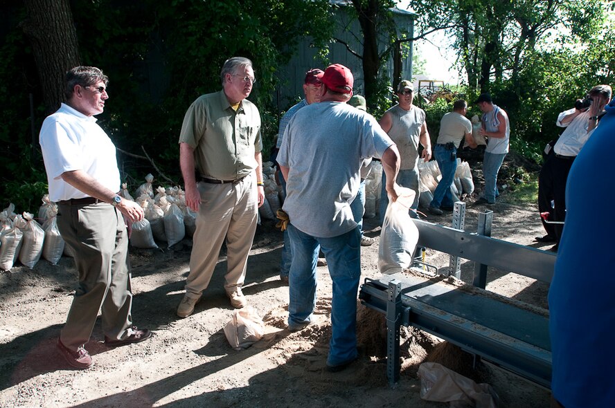 Governor Jay Nixon visits with locals from the town of  Fortescue, in Northern Missouri, on June 22, 2010,  as devastating flood waters spread throughout the rural landscape and threaten this small town. Gov. Nixon is accompanied by Brigadier General Stephen Danner, Mo. Adjutant General, Colonel Mike McEnulty, 139th Airlift Wing Commander, and local journalists as he visits the local community and surveys the damage.  (U.S. Air Force photo by Master Sgt. Shannon Bond/Released)