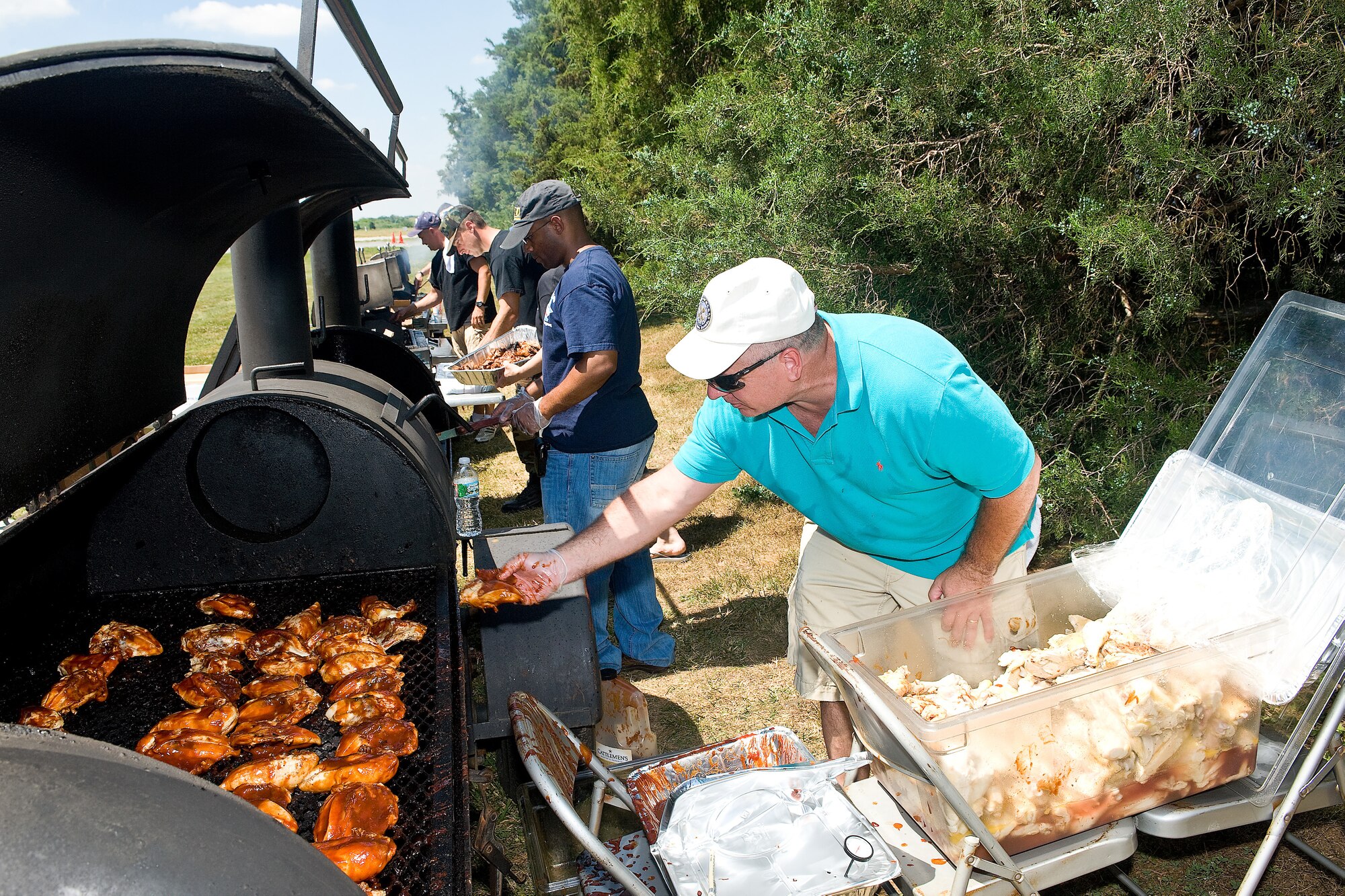 Dover Air Force Base First Sergeants barbeque for the Dover Air Force Base Wing Picnic Juine 18.  The First Sergeants, Top III and Retiree Affairs all volunteered to assist with food preparation for the picnic.  A buffet of hot dogs, hamburgers and barbeque chicken was available.  (U.S. Air Force photo by Roland Balik/Released)