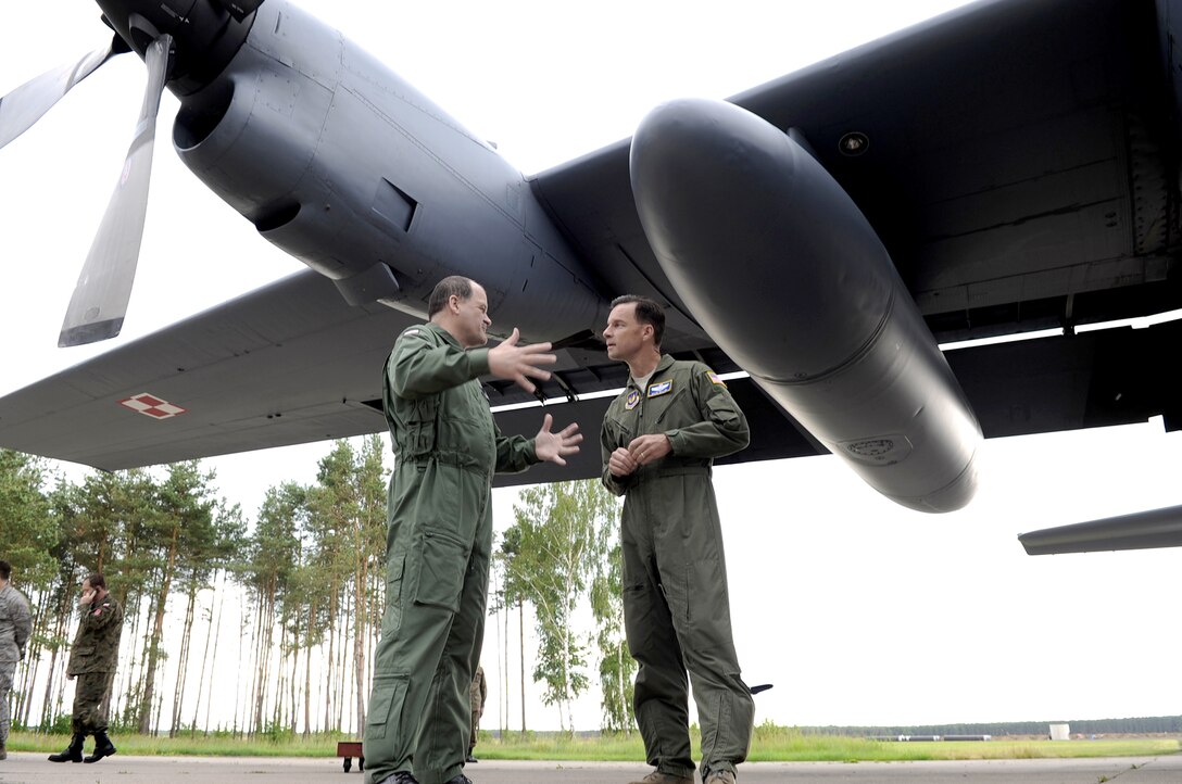 U.S. Air Force Brig. Gen. Mark Dillon and Polish air force Brig. Gen. Tadeusz discuss Polish aircraft June 21, 2010 on Powidz Air Base, Poland. General Dillon visited Poland to sign a letter of intention designating the 86th Airlift Wing and the 3rd Airlift Wing as sister wings and to build partnerships. General Dillon is the 86th AW commander and General Mikutel is the 3rd AW commander. (U.S. Air Force photo/Airman 1st Class Grovert Fuentes-Contreras)