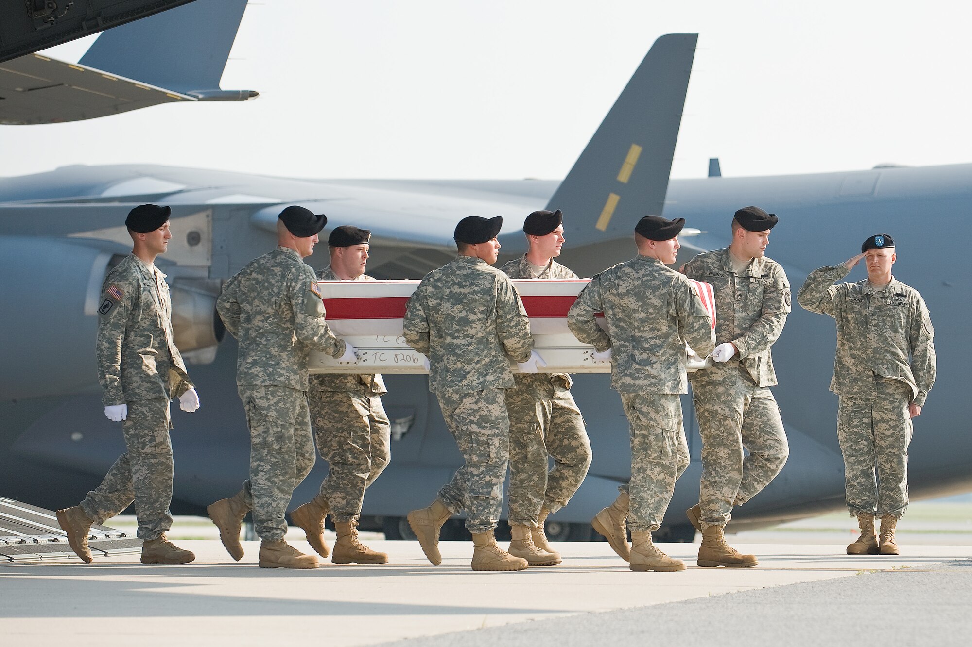 A U.S. Army carry team transfers the remains of Army Staff Sgt. James P. Hunter, of South Amherst, Ohio, at Dover Air Force Base, Del., June 20. (U.S. Air Force photo/Roland Balik)