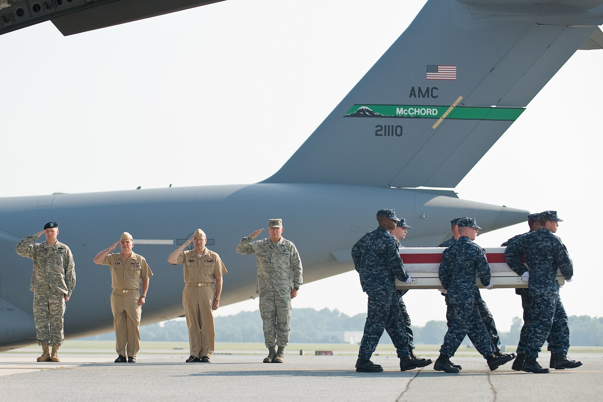 A U.S. Navy team transfers the remains of Navy Seaman William F. Ortega, of Miami, Fla., at Dover Air Force Base, Del., June 20. Seaman Ortega was assigned as a hospital corpsman to Third Battalion, First Marine Regiment, First Marine Division, I Marine Expeditionary Force. (U.S. Air Force photo/Roland Balik)