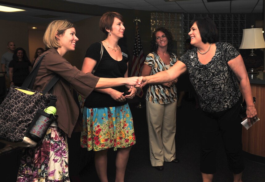 SHAW AIR FORCE BASE, S.C. - Mrs. Beverly Fraser (right), wife of Air Combat Command Commander, Gen. William M. Fraser III, shakes hands with members of the Key Spouse Program June 16, 2010. Mrs. Fraser visited the Airman and Family Readiness Center while on an official tour of Shaw Air Force Base, S.C., General Fraser and his wife visited Shaw to gain insight into the mission and speak with Airmen from units across the base to hear their concerns. (U.S. Air Force photo/Airman 1st Class Amber E. N. Jacobs) 