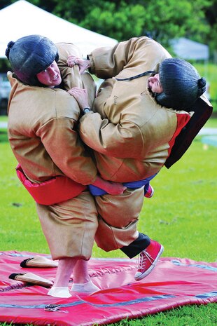 Attendees wrestle in sumo suits at a previous year's Freedom Fest on Naval Weapons Station Charleston. In addition to inflatable jump castles, slides, sumo wrestling and jousting tournaments, this year's festival scheduled for July 2 will feature hot air balloon rides. The festivities will continue July 3 with a street dance from 7 to 11 p.m. and a showing of "Alice in Wonderland" beginning at dark July 4. (U.S. Navy photo)