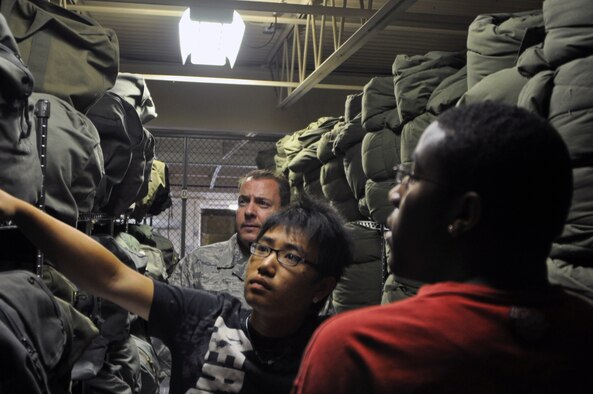 Beng Cha, 19, and Adrian Wells, 18, organize sleeping bags under the supervision of Master Sgt. William ‘Bugs’ Moran, the noncommissioned officer-in-charge of war readiness, in the war readiness facility at the 128th Air Refueling Wing, Gen. Mitchell International Airport, on Wednesday, June 23, 2010.  The 128 ARW hosts Milwaukee-area youth during a seven-week Aviation Careers and Education program designed to give the youths work experience for their future careers.  (U.S. Air Force photo by Senior Airman Ryan Kuntze / Released) 