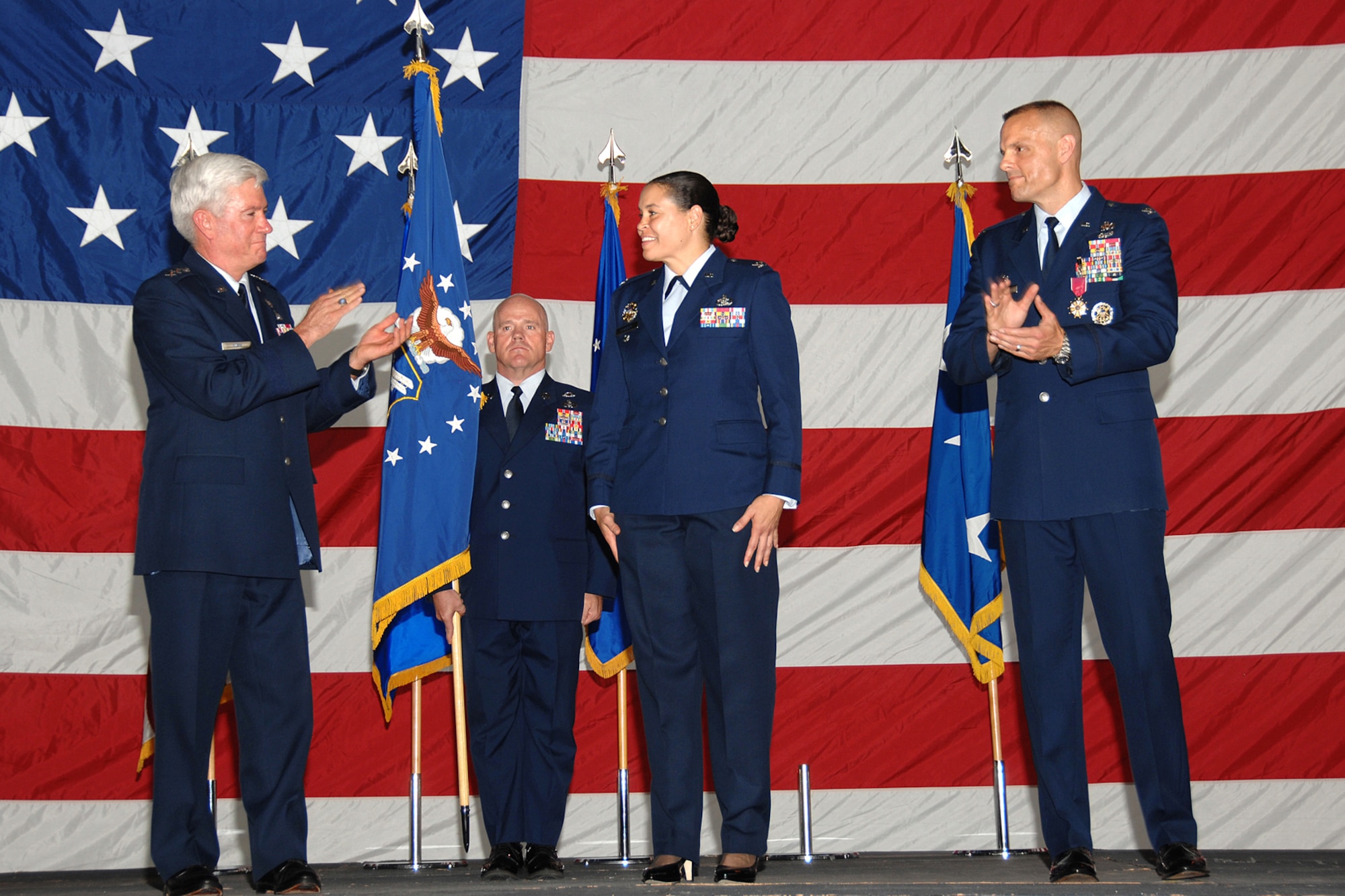 Lt. Gen. Tom Owen and Col. Brad Spacy congratulate Col. Amanda Gladney during the 88th Air Base Wing change of command ceremony June 21, 2010 at Wright-Patterson Air Force Base, Ohio. Col. Gladney succeeded Col. Spacy as 88th ABW commander at the ceremony. Lt. Gen. Owen is Aeronautical Systems Center commander at the base. (U.S. Air Force photo/Ben Strasser) 