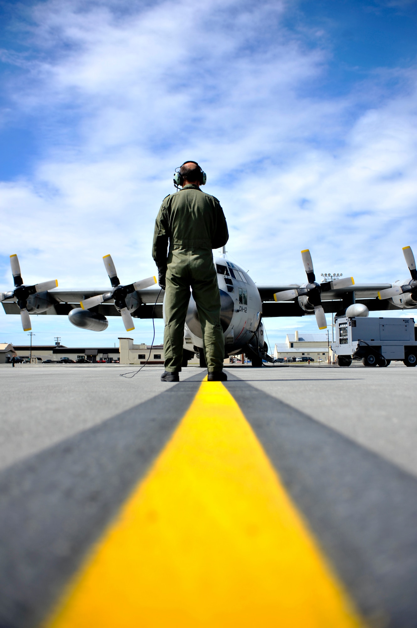 JOINT BASE ELMENDORF-RICHARDSON, Alaska – Adjudant Gert Van Den Berghe, Belgian Air Component 15th Air Transport Wing 20th Squadron loadmaster, prepares a Belgian C-130 Hercules for takeoff  June 22. This was the first time the BAC has participated in RF-Alaska. (Air Force photo by Airman 1st Class Christopher Gross)