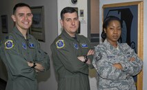 MINOT AIR FORCE BASE, N.D. -- 5th Operations Support Squadron’s wing scheduling leadership pose for a photo in the 5th Operations Group here June 23. Wing scheduling plans out short- and long-range coordination with many of the squadrons on base. (U.S. Air Force photo by Senior Airman Benjamin Stratton)