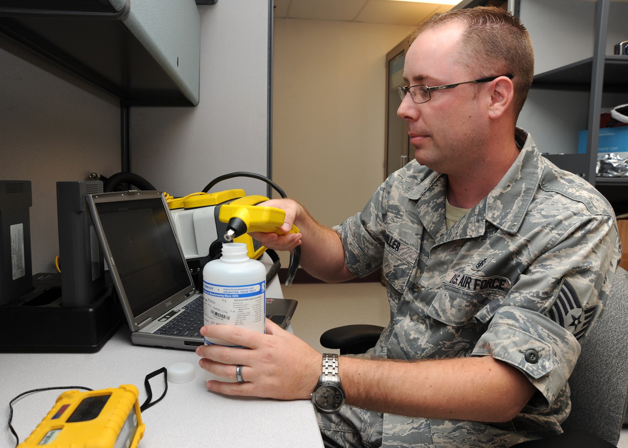 Tech. Sgt. Shayne Miller, 22nd Aerospace Medicine Squadron bioenvironmental engineering NCOIC of readiness and environmental elements, tests a gas chromatoharph mass spectrometer on a practice sample at the base clinic June 3, 2010, McConnell Air Force Base, Kan.  The $150,000 spectrometer measures air and soil organic compounds to evaluate if it contains chemical substances harmful to individuals.  The spectrometer’s accompanying computer program also identifies what the compounds are in an unknown substance during an emergency.  Bioenvironmental engineering Airmen survey and evaluate community and industrial workplace environments, and recommend controls to keep hazardous environmental and occupational exposures within acceptable limits. (U.S. Air Force photo/ Senior Airman Maria Ruiz)