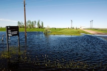 MINOT AIR FORCE BASE, N.D. -- The base has experienced an abnormally high amount of precipitation over the past few weeks resulting in flooding of various areas of the base to include this site operated by the 5th Communications Squadron seen here June 22. (U.S. Air Force photo by Airman 1st Class Aaron-Forrest Wainwright)