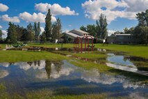 MINOT AIR FORCE BASE, N.D. -- A playground in base housing sits under water from overnight thunderstorms that produced torrential rain here June 21. The ground is saturated from numerous rain showers and thunderstorms that have moved through the Minot area over the past few weeks. (U.S. Air Force photo by Master Sgt. Michael Gaddis)