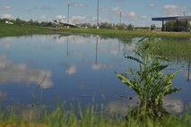MINOT AIR FORCE BASE, N.D. -- Is it a new base lake in front of the Shoppette? No, it is just standing water from overnight thunderstorms that produced torrential rain here June 21. The ground is saturated from numerous rain showers and thunderstorms that have moved through the Minot area over the past few weeks. (U.S. Air Force photo by Master Sgt. Michael Gaddis)