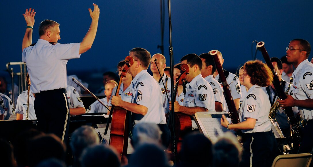 Lt. Col. A. Phillip Waite, United States Air Force Band commander, conducts the Air Force Band’s Concert Band during his first public concert June 18. The Band’s six performing ensembles take turns performing throughout the summer at the Air Force Memorial each Wednesday and Friday with no fee for attendance. Lt. Col. A. Phillip Waite assumed command of the Air Force Band in a change-of-command ceremony June 1. (U.S. Air Force photo by Staff Sgt. Raymond Mills)