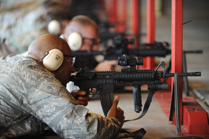 U.S. Air Force Tech. Sgt. Antonio Frese fires an M-4 rifle on the improved weapons firing range on Joint Base Charleston, S.C., June 21, 2010. Firing ammo rounds on the range is part of the certification process to ensure no rounds are exiting or ricochet from the range. Sergeant Frese is the deputy Raven program manager with the 628th Security Forces Squadron. (U.S. Air Force photo/James M. Bowman)(released)

