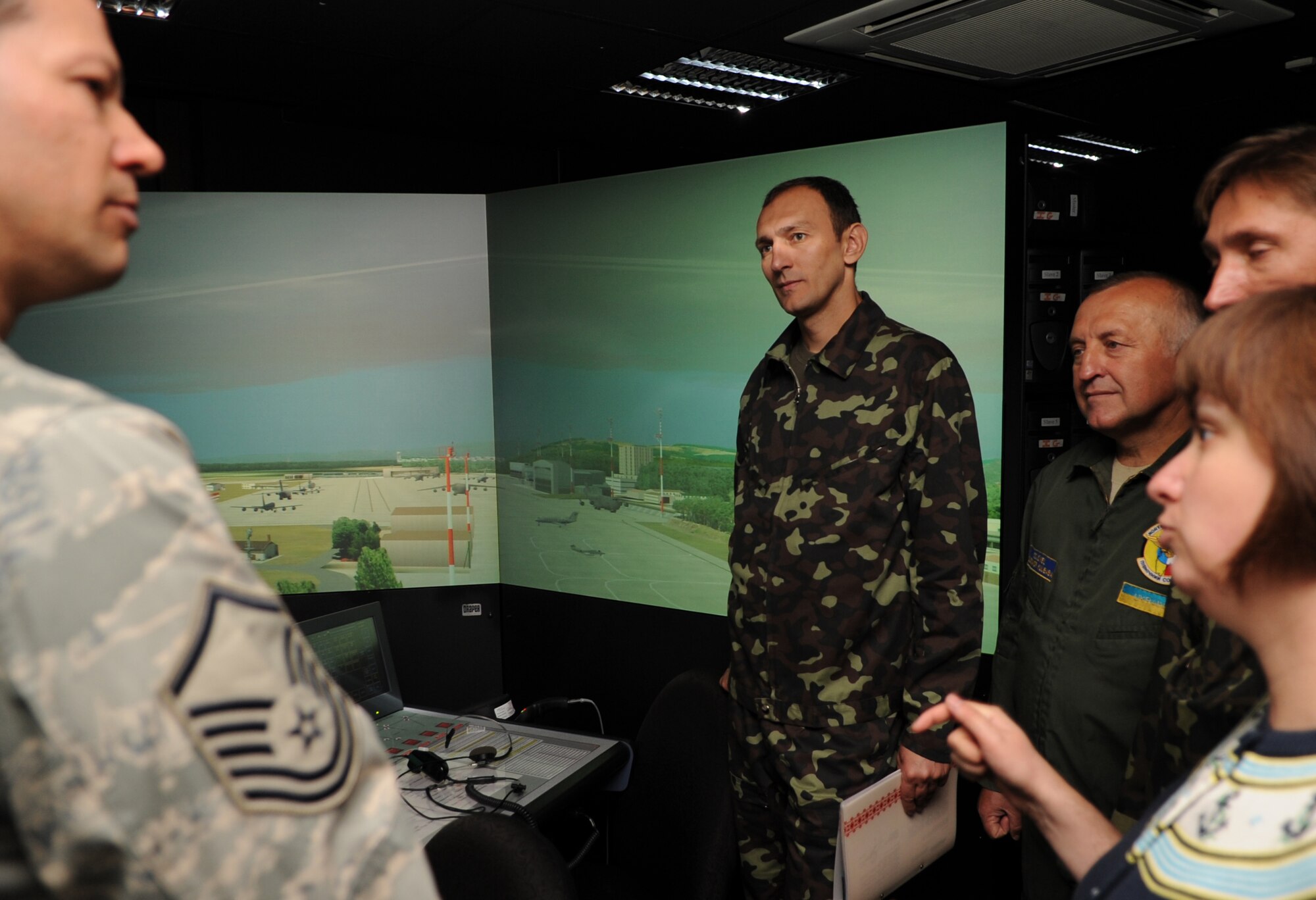 U.S. Air Force Master Sgt. Roy Wanner, 86th Operations Support Squadron air traffic control complex chief controller, gives a tour of the air traffic control training simulation room to Ukraine Air Force members during a visit to Ramstein Air Base, Germany, June 23, 2010.  The goal of the Ukrainian visit was to help advance military interoperability and build international partnerships. (U.S. Air Force photo by Senior Airman Caleb Pierce)