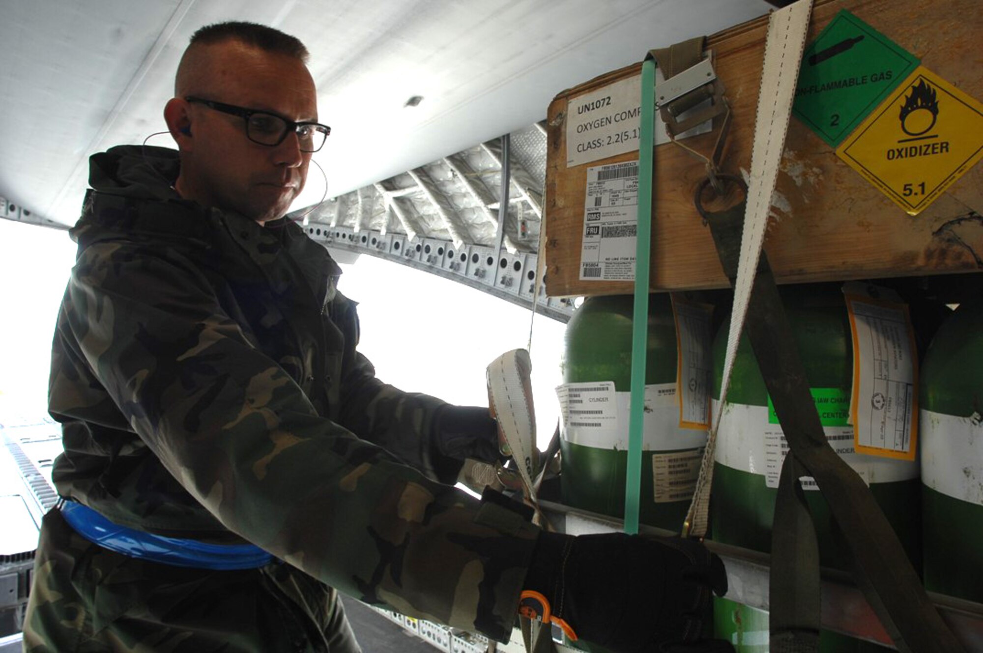 Kasper Chevalier, 721st Aerial Port Squadron aerial porter checks over the cargo after being loaded into a C-17, Globemaster III. Recently Mr. Chevalier became the first Air Force civilian to reach 500 APEX missions. The APEX program allows select air transportation personnel to obtain qualifications similar to aircraft loadmasters, enabling a shorter on the ground time for loadcrews. (U.S. Air Force photo by Tech. Sgt. Michael Voss)