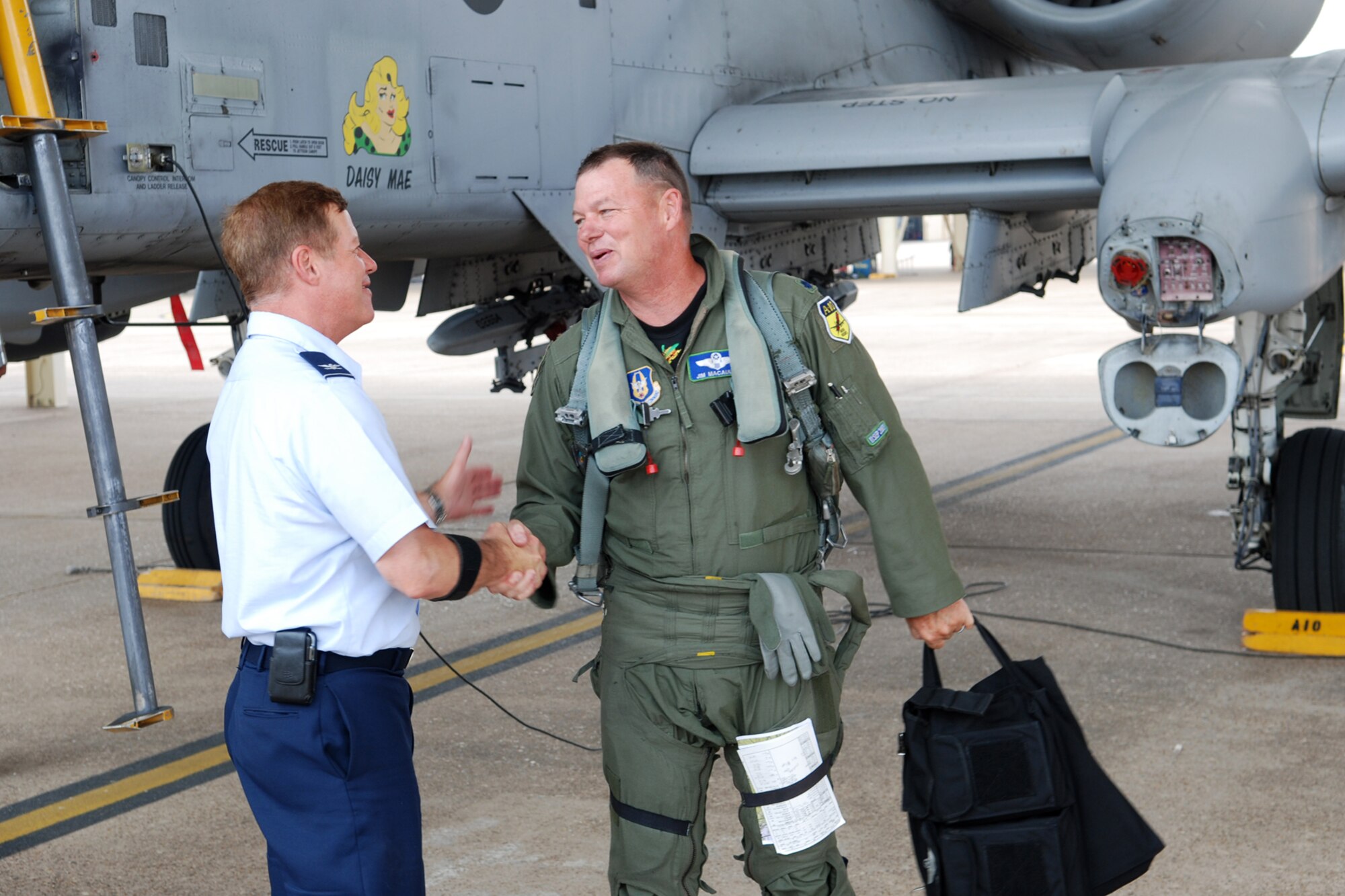 Col. Keith Schultz, commander, 917th Operations Group, congratulates Lt. Col. James “Mace” Macaulay, 917th OG, deputy commander, following his return from a sortie that pushed him over the 5000 flying hours mark in an A-10 Thunderbolt II at Barksdale Air Force Base, La., June 21, 2010. (U.S. Air Force photo/Master Sgt. Greg Steele)