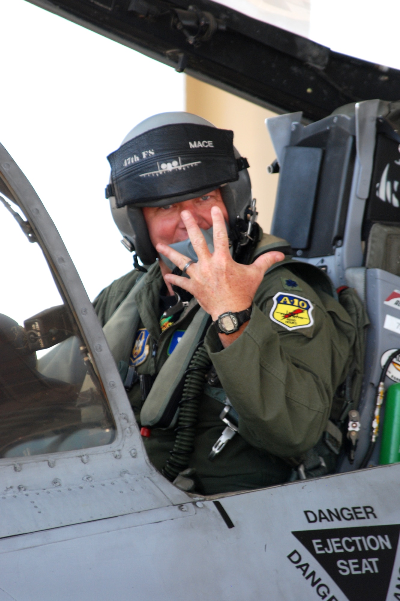 Lt. Col. James “Mace” Macaulay, deputy commander, 917th Operations Group, holds up five fingers representing the 5000 flying hours mark he surpassed after his return from a sortie in an A-10 Thunderbolt II at Barksdale Air Force Base, La., June 21, 2010. (U.S. Air Force photo/Master Sgt. Greg Steele)