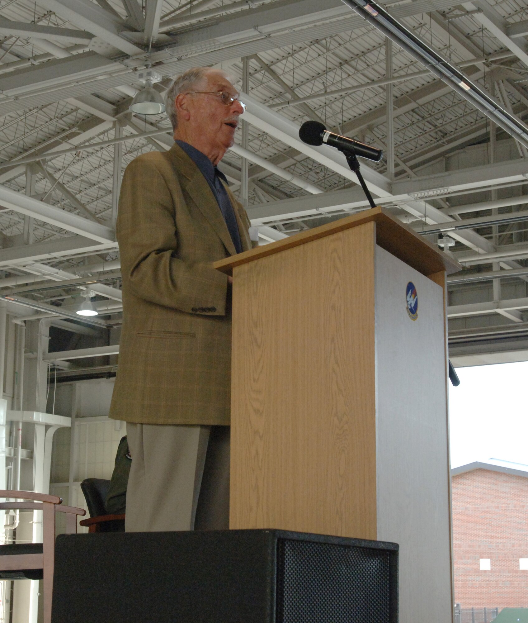 LANGLEY AIR FORCE BASE, Va. -- P.E. "Mac" MacAllister, a former 71st Pursuit Squadron armament officer and World War II veteran, speaks to the audience at the 71st Fighter Squadron open house in the squadron hangar June 18. The festivities included awards presentations, free food and visits from distinguished alumni in celebration of the impending squadron inactivation. (U.S. Air Force photo/Airman 1st Class Jason J. Brown)
