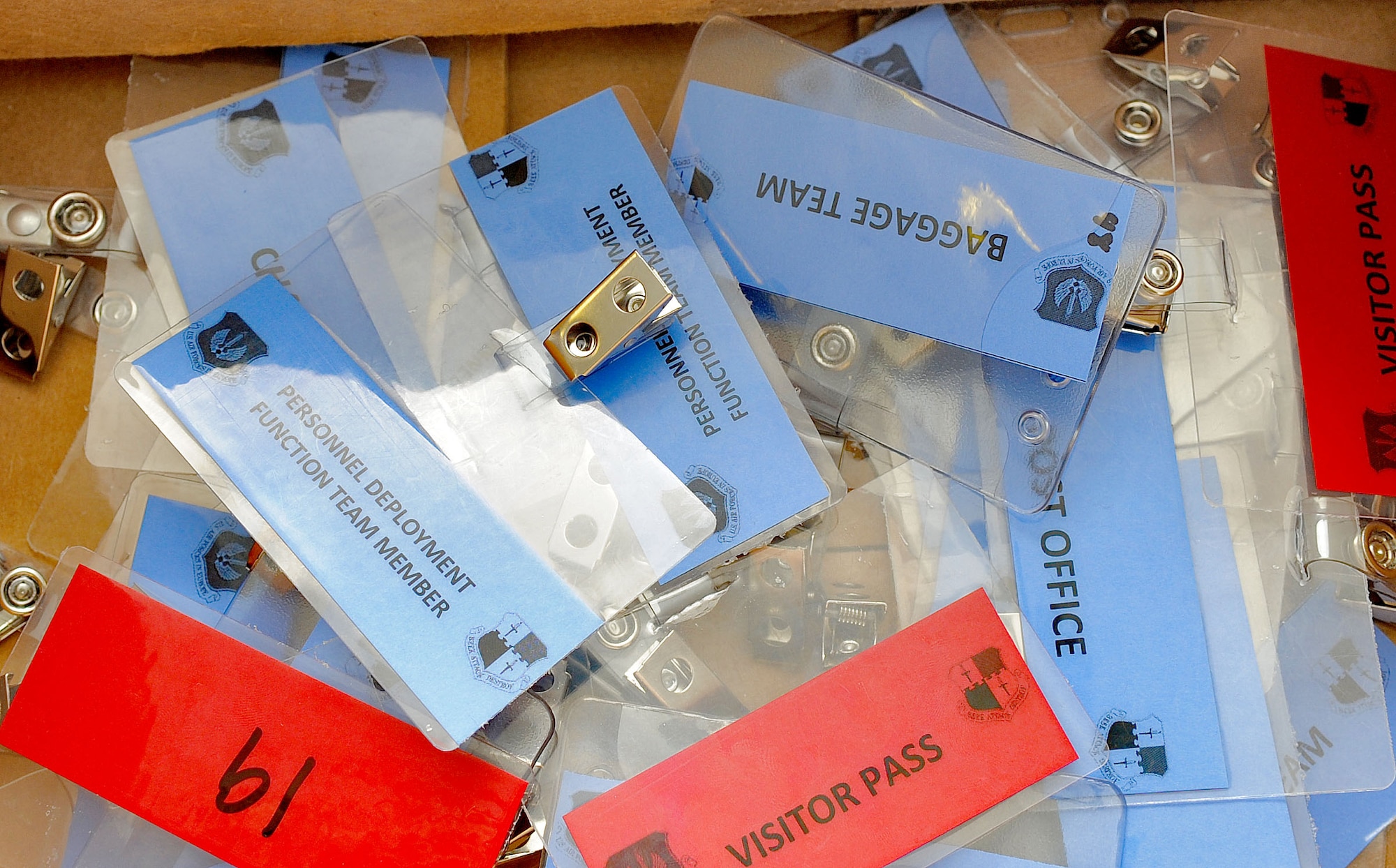 SPANGDAHLEM AIR BASE, Germany – Unit and personnel badges are given to members before they can go into the personnel deployment function during a Phase I Operational Readiness Inspection June 21.The PDF is part of a predeployment checklist Airmen must go through to ensure they have all the proper documentation, medical clearances and requirements to deploy. (U.S. Air Force photo/Airman 1st Class Nick Wilson)
